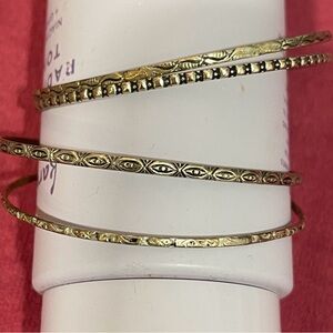Silver bangles - 4 . Various patterns .